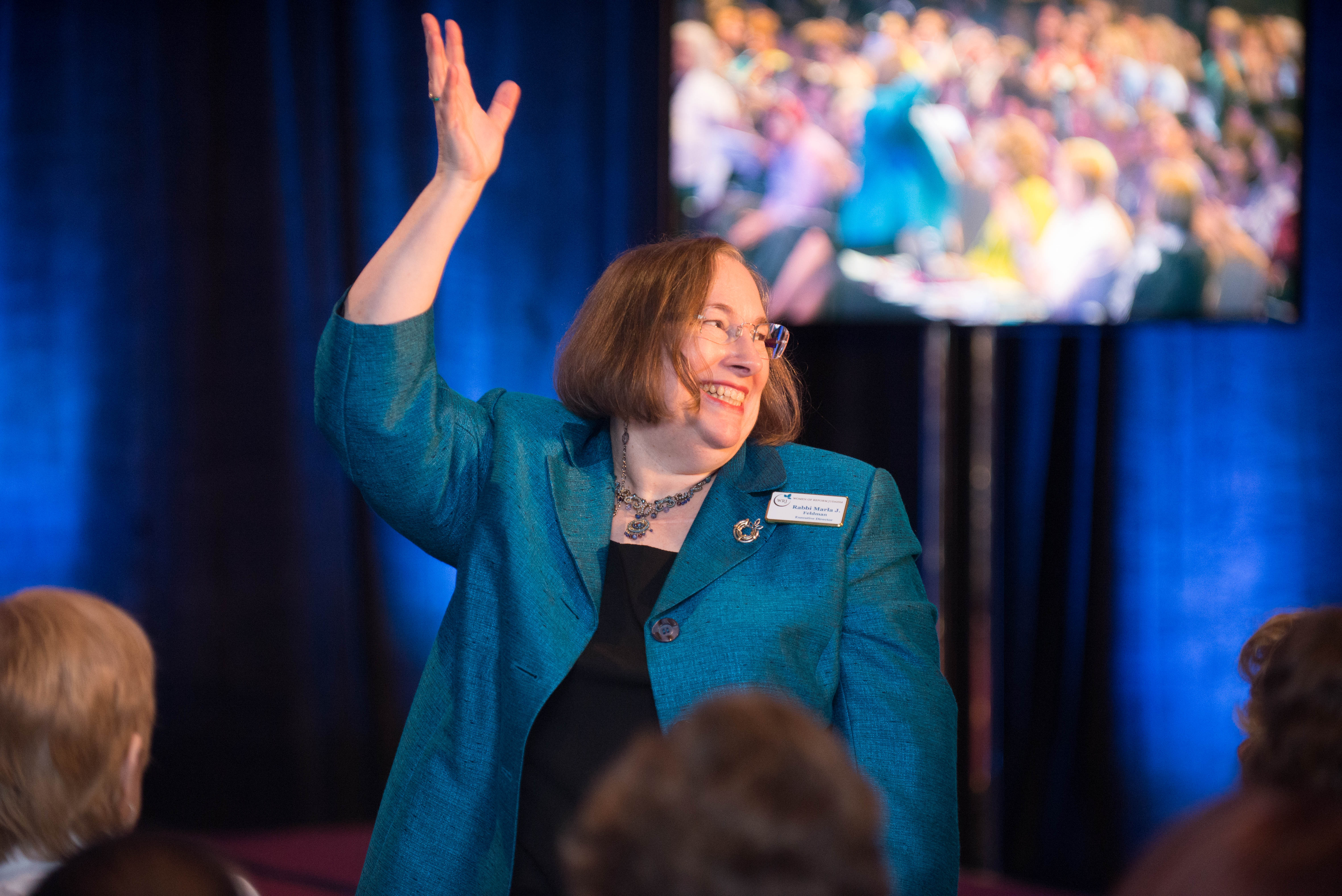 Rabbi Marla J. Feldman waving