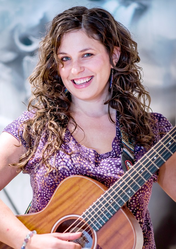 Carla Friend with a guitar