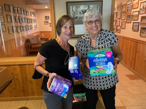 Women collecting tampons and pads to donate to shelters and those in need.