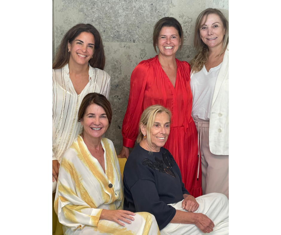 A group of women standing together. 